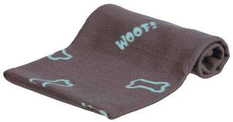 Graue Decke mit hellblauen Knochenmotiven und dem Schriftzug "Woof!" in derselben Farbe aufgerollt.