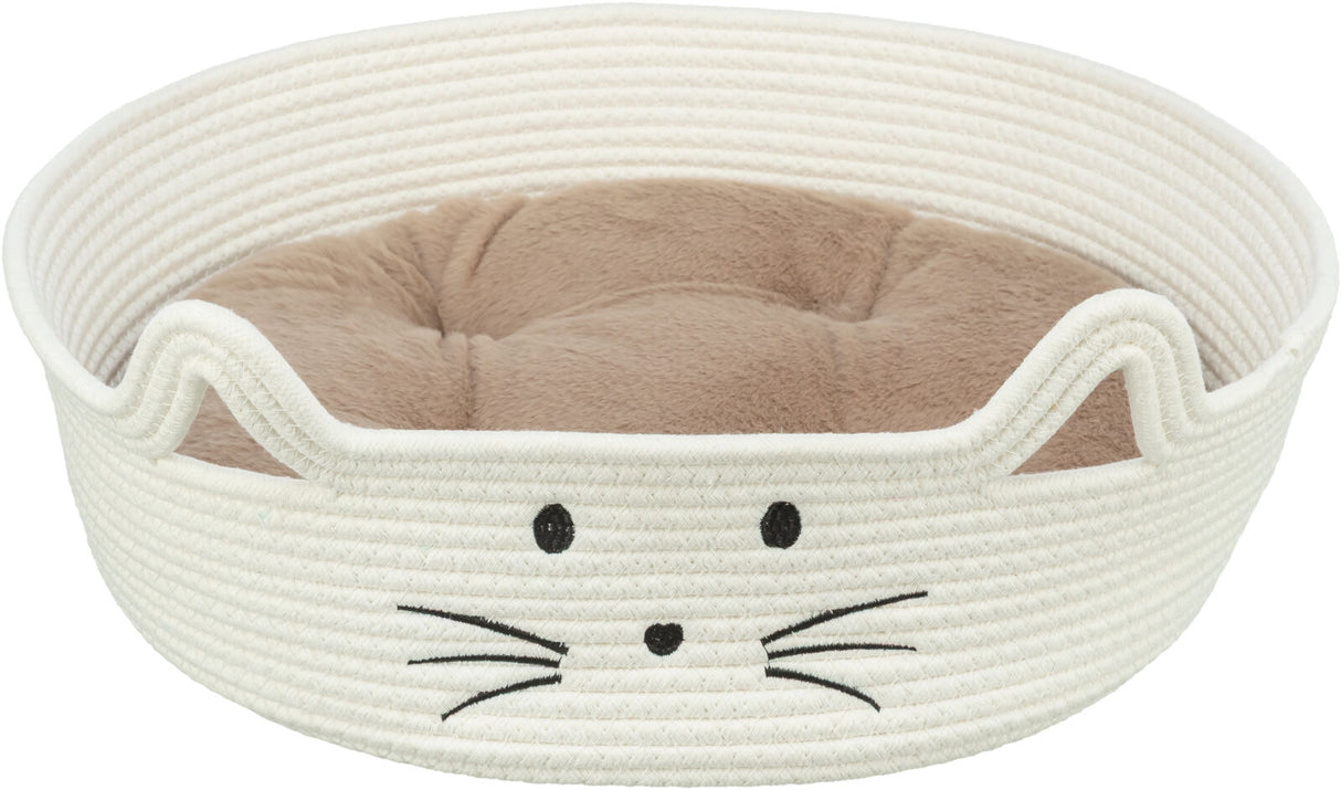 Rundes, weißes Katzenbett mit aufgesticktem Katzengesicht und innen liegendem, beigefarbenem Kissen.