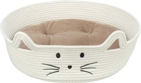 Rundes, weißes Katzenbett mit aufgesticktem Katzengesicht und innen liegendem, beigefarbenem Kissen.