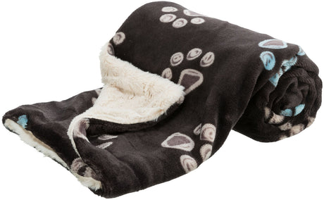 Schwarze Decke mit beigefarbenem, flauschigem Innenfutter und hellen Pfotenabdruckmustern.