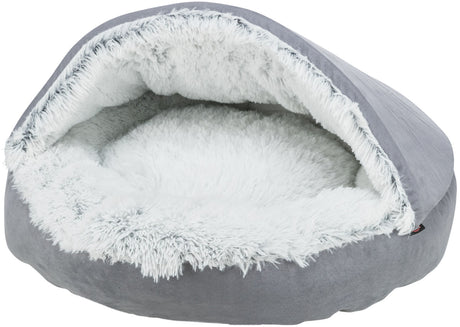 Rundes, graues Bett mit flauschigem weißen Innenfutter, halbrund überdacht, vermutlich für Haustiere.
