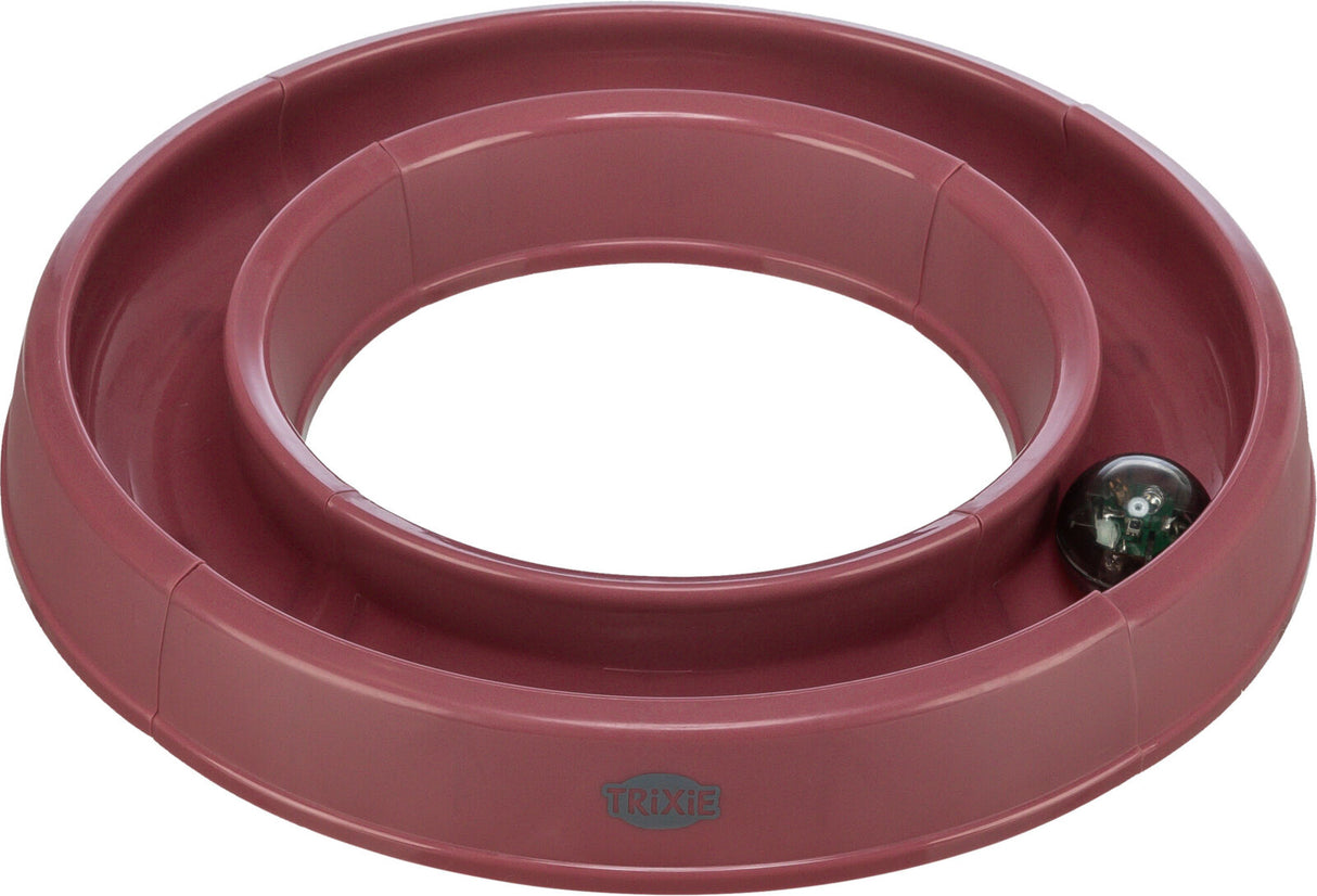 Roter, runder Spielzeugring mit einer kleinen Kugel im Inneren, sichtbar mit "Trixie" Logo.