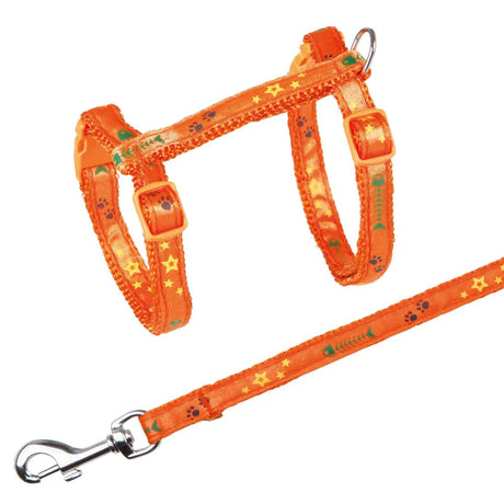 Orangefarbiges Geschirr mit Leine, dekoriert mit Sternen und Pfotenabdrücken, zeigt einen Metallhaken.