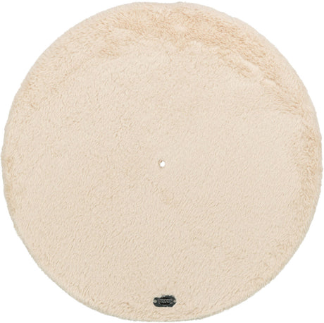 Runde, beige, flauschige Matte mit einem kleinen Loch in der Mitte und einem Etikett am Rand.