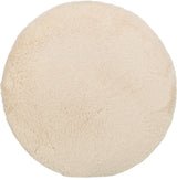 Runde, flauschige, cremefarbene Oberfläche ohne sichtbare Details oder Muster.