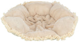 Beiges, rundes, flauschiges Kissen mit Fransenrand aus weichem Stoff, sichtbar von oben.