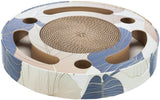 Runde, flache Struktur mit Blättermuster in Blau und Beige, in der Mitte ein kreisförmiges, löchriges Element.