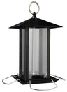 Schwarzes, sechseckiges Vogelhaus aus Metall und Glas mit rundem Aufhängering und silbernen Sitzstangen.