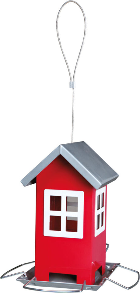 Rotes, hausförmiges Vogelhaus mit silbernem Dach und Aufhängeschlaufe, auf Metallboden befestigt.