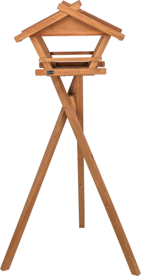 Holz-Vogelhaus auf drei Beinen mit schrägem Dach, naturfarben, ohne sichtbare Dekorationen oder Tiere.
