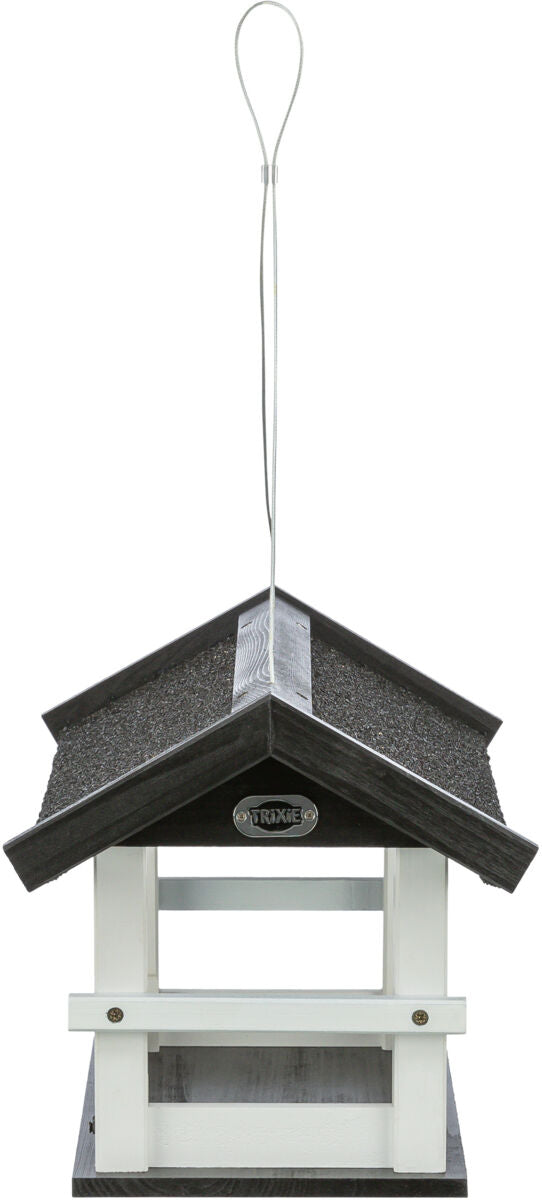 Schwarzes und weißes Vogelhaus mit Satteldach aus Holz, Aufhängung oben, Marke sichtbar "Trixie".