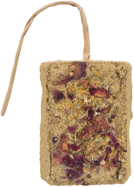 Rechteckiger Block mit getrockneten Pflanzen und Blüten, beige Farbe, oben mit Papierband versehen.