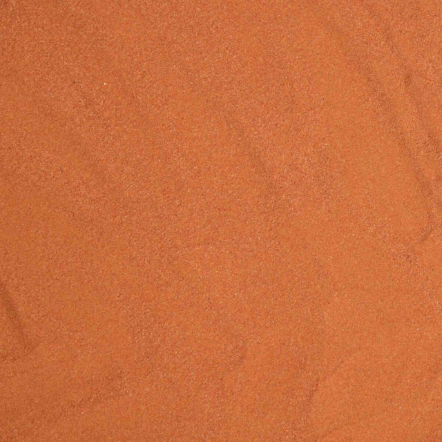 Orangefarbener Sand mit feiner Körnung, gleichmäßig verteilt ohne erkennbare Muster oder Objekte.