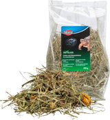Klarsichtverpackung mit getrockneten Gräsern und Wiesenkräutern für Landschildkröten, markiert mit "TRIXIE" und 200g.