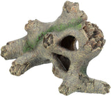 Dekorationsstück in Form eines Baumstamms mit rauer, brauner Oberfläche und grüner Moosstruktur.