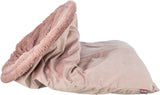 Weiches, rosafarbenes Kuschelbett mit plüschiger Umrandung, geeignet zum Einkuscheln, mit kleinem Markenlabel.