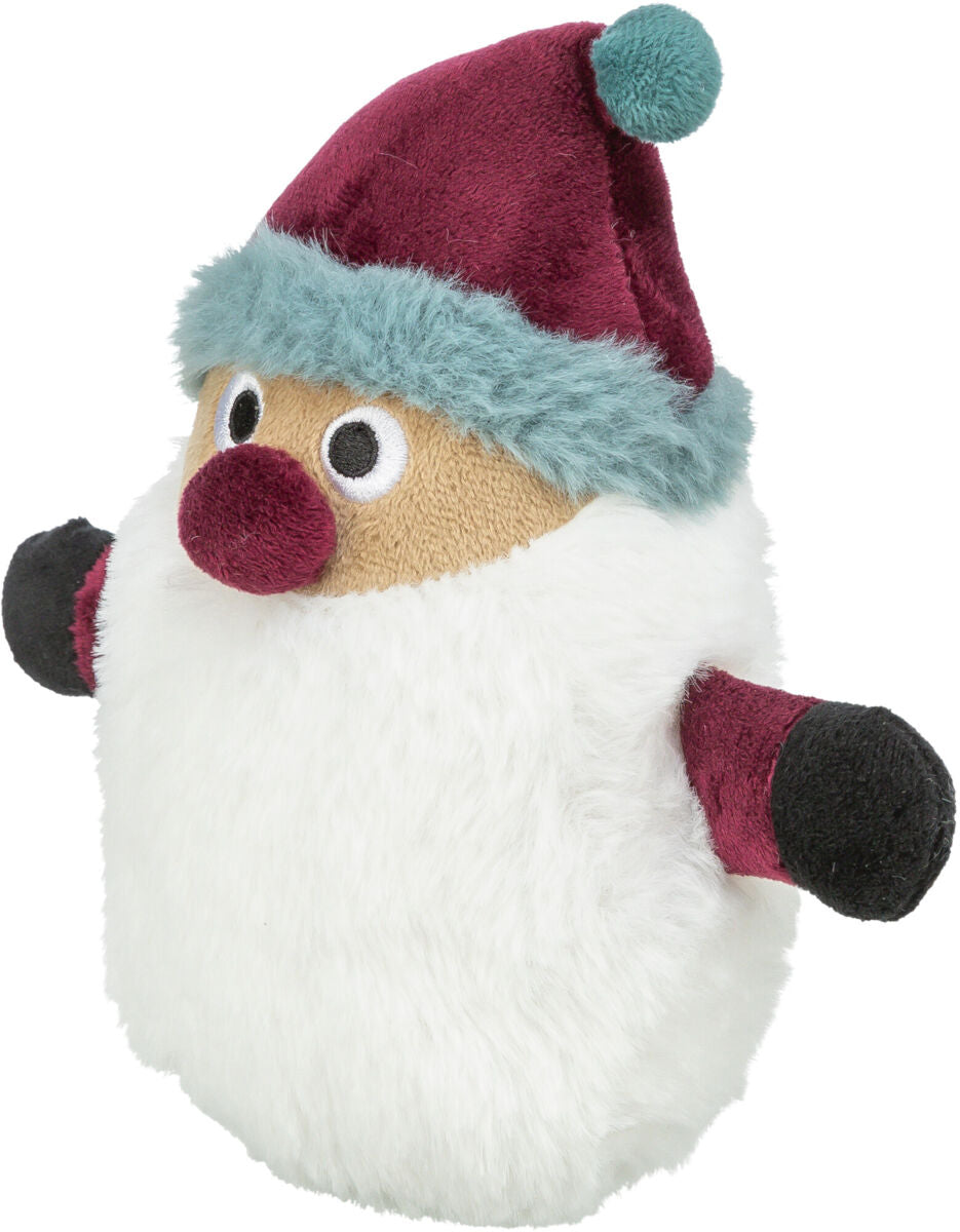 Plüschfigur mit roter Mütze, weißem Bart und großen Augen, ähnelt einer weihnachtlichen Figur.