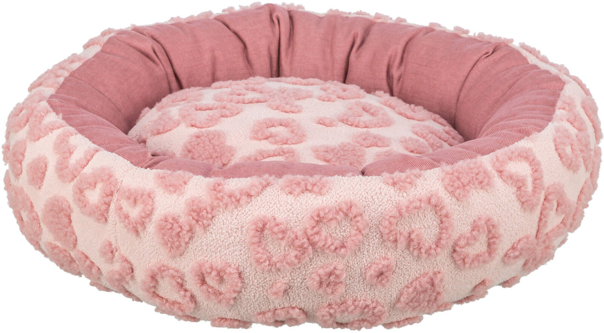 Rundes, flauschiges, rosa Bett mit Herzmuster und erhöhter Umrandung.