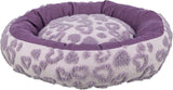 Rundes, flauschiges Liegebett in Lila mit einem Muster aus herzförmigen Erhebungen auf der Oberseite.
