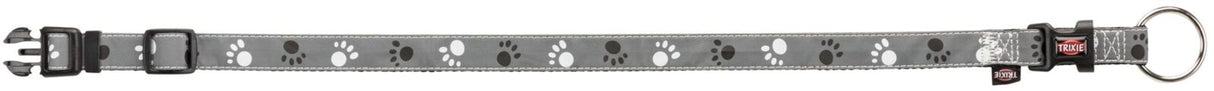 Graues Hundehalsband mit weißen und schwarzen Pfotenabdrücken und Schnalle, Marke "Trixie" erkennbar.